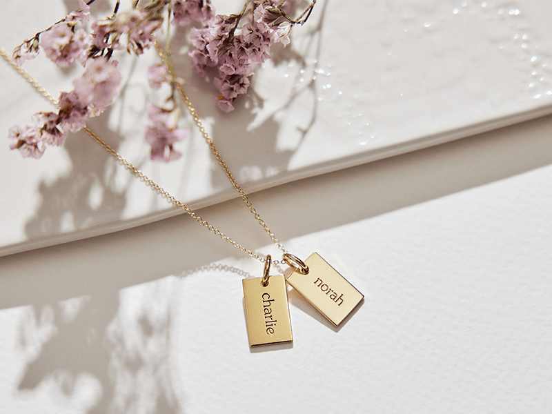 our best selling and loved by madi nelson mini dog tag necklaces. singles or multiple names available.