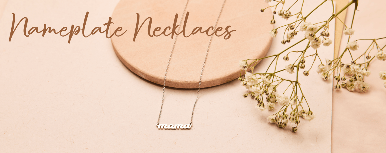 our delicate nameplate necklaces in our signature script. can add up to four names.