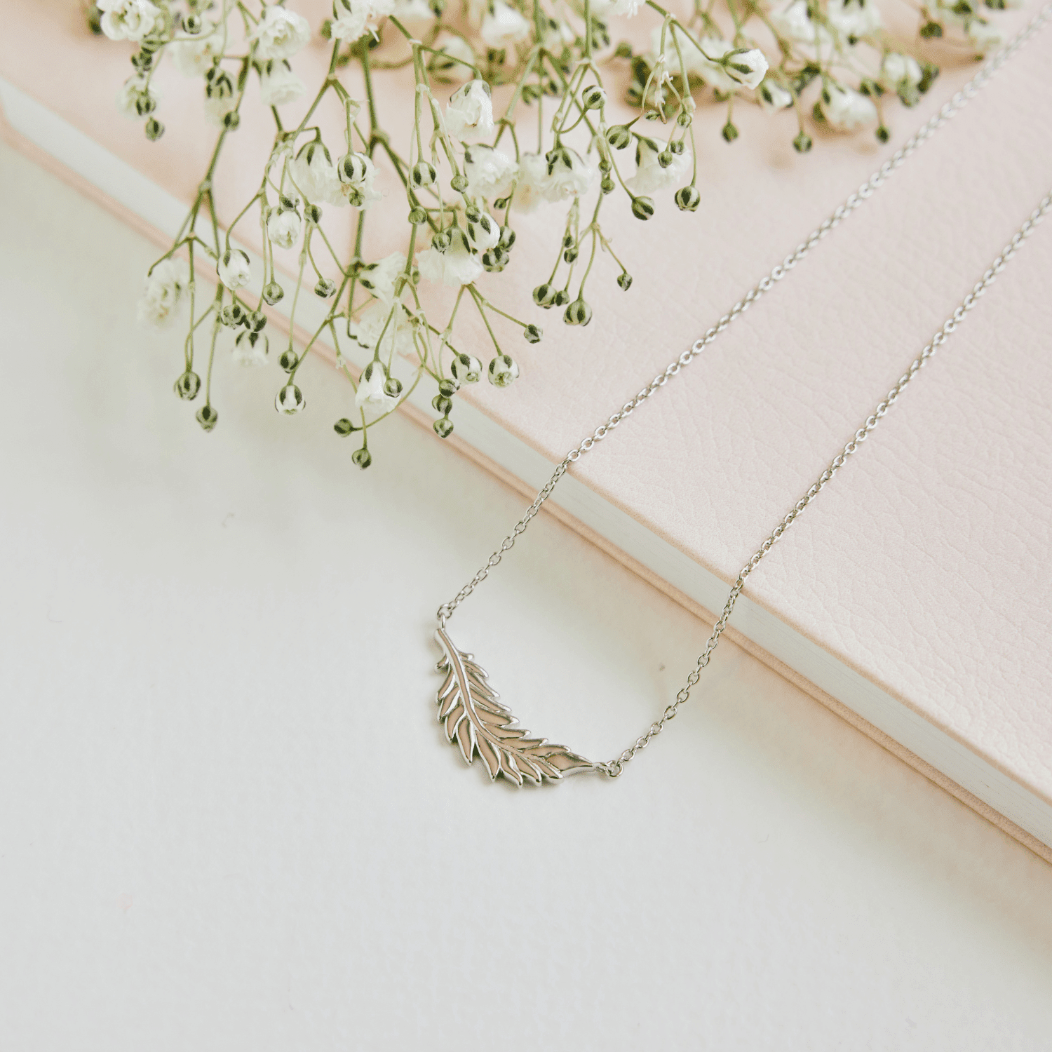 Floating Flamingo Feather Necklace by Lindsey Gurk