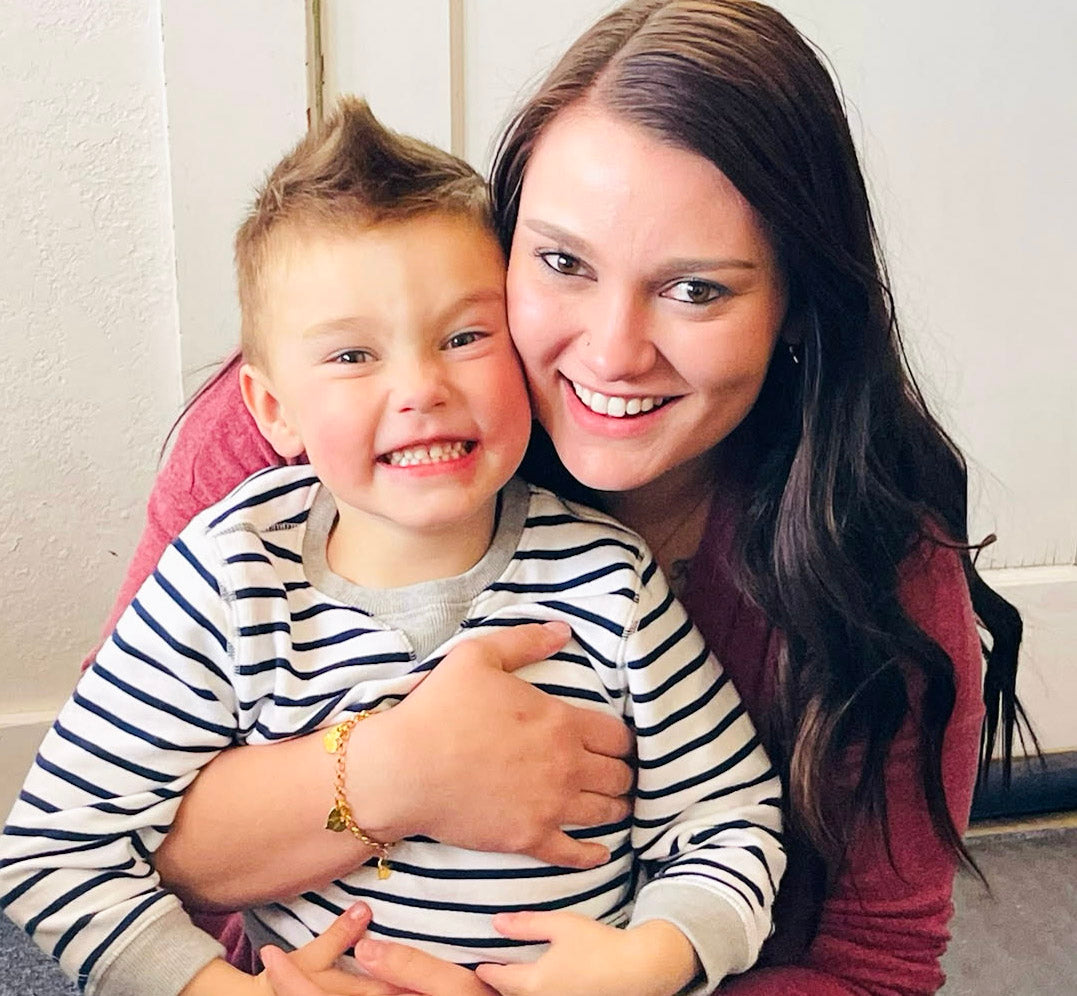 mom and boy, mom and baby, motherhood, miscarriage, losing a child, love after loss, tiny tags, angel wings, angel wings bracelet