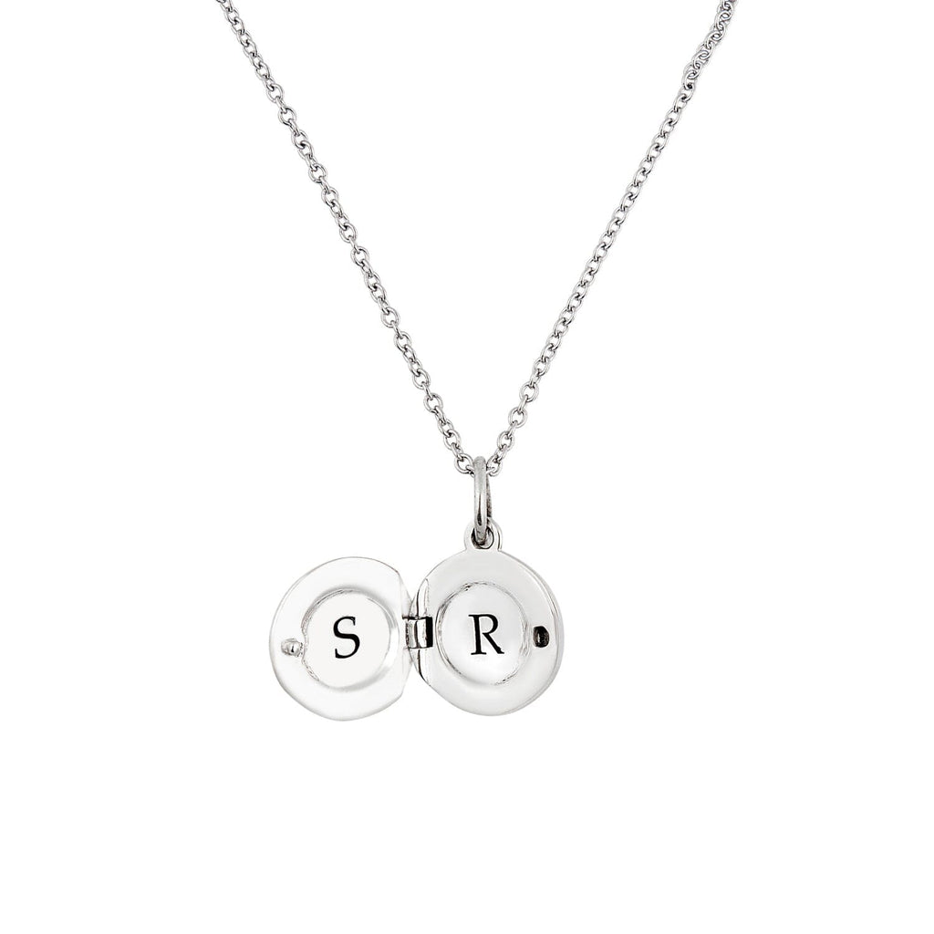 inside with engraving of a sterling silver round mini locket necklace on white background