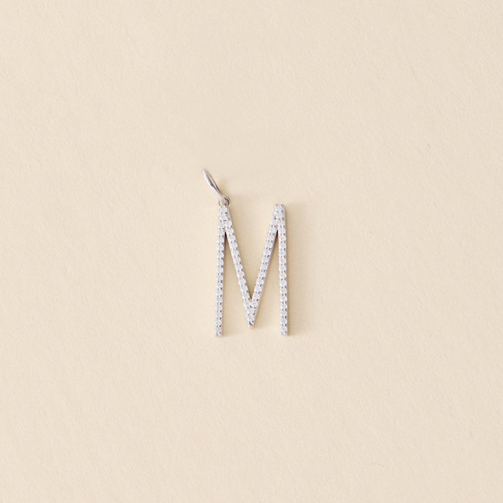 Pave Initial Charm