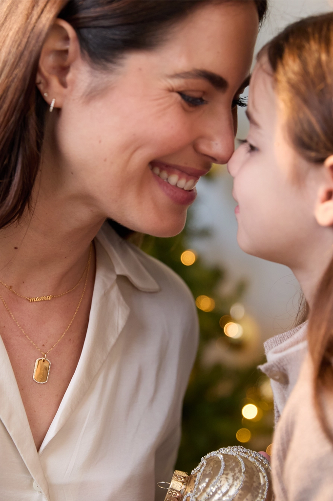 mother and daughter sharing an eskimo kiss