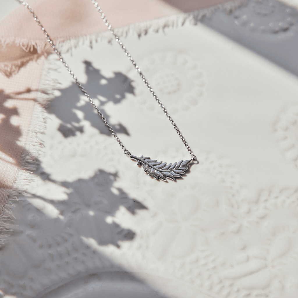 Floating Flamingo Feather Necklace by Lindsey Gurk
