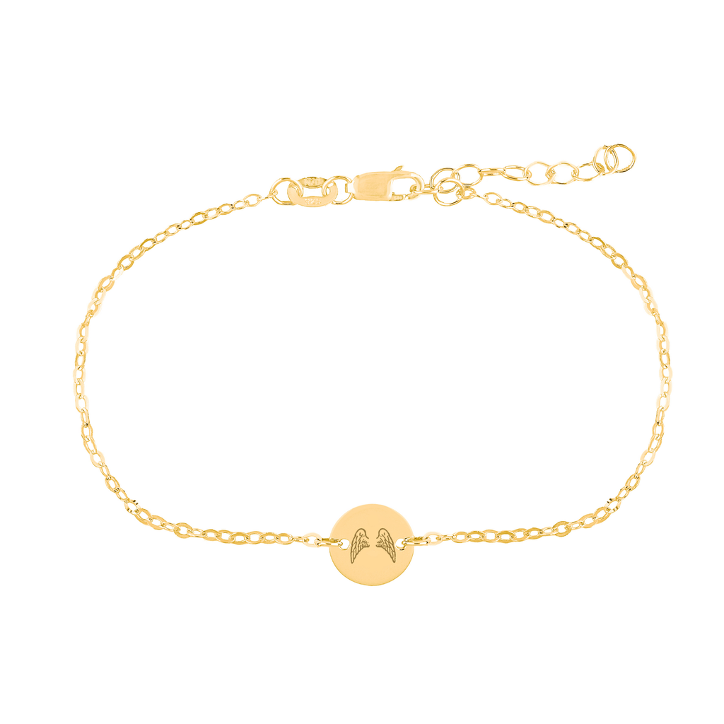 gold wings bracelet on white background 